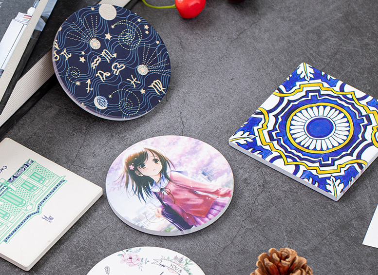 A collection of colorful custom-printed ceramic Christmas ornaments hanging together.