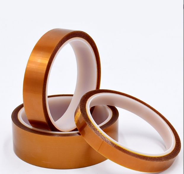 A collection of heat press accessories: Teflon sheet, heat tape, and a pressing pillow.