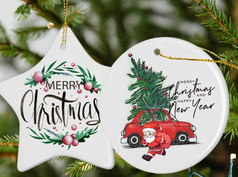 A cozy, festive scene with a Christmas tree in the background, and a person's hands holding a newly sublimated ornament showing a family photo.