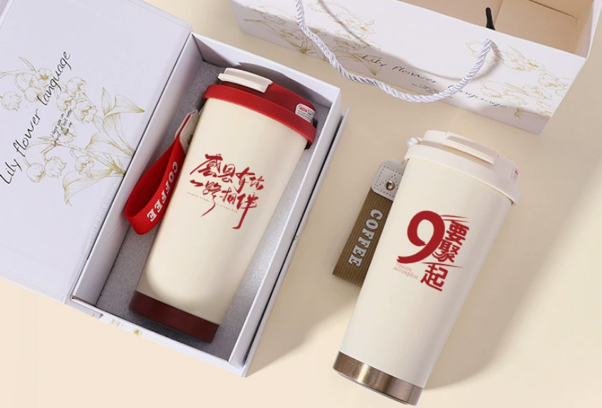 A person's hands holding a beautifully personalised water bottle, ready to be wrapped as a gift.