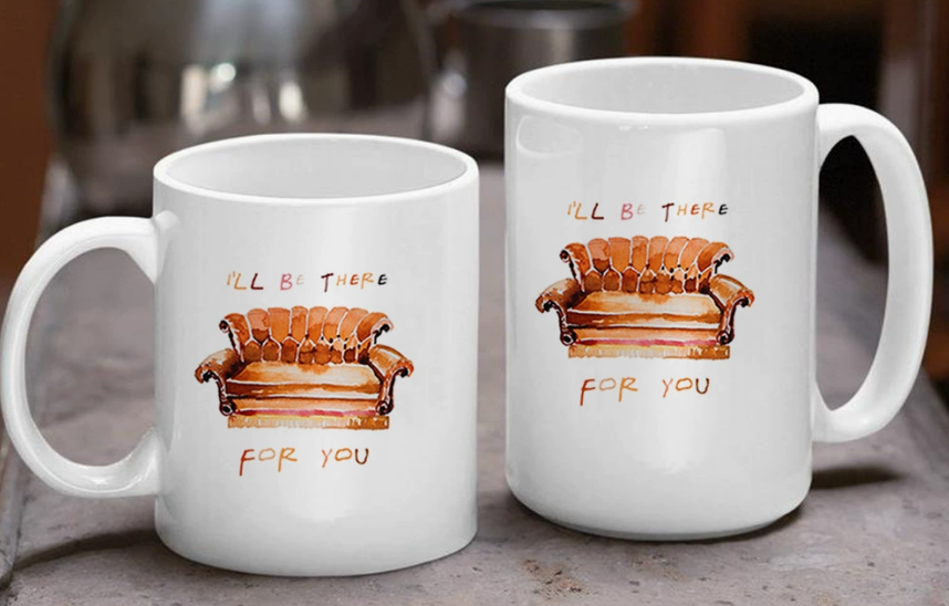 A side-by-side comparison of a smaller 11 oz sublimation mug and a larger, wider 15 oz sublimation mug, highlighting the difference in size.